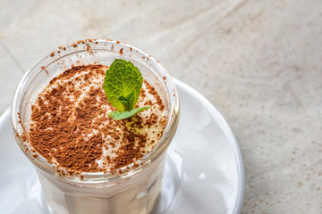 Tiramisu dessert with a mint leaves on top