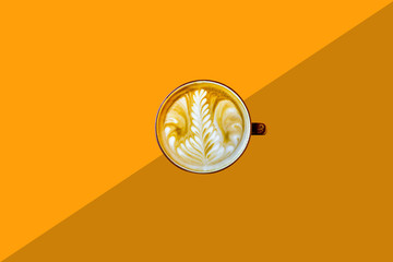 Top view latte coffee of hot art isolated on wooden background.