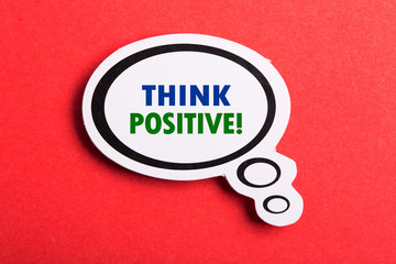 Think Positive Speech Bubble Isolated On Red Background