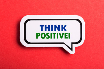 Think Positive Speech Bubble Isolated On Red Background