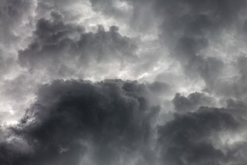 The storm clouds are blowing rain.