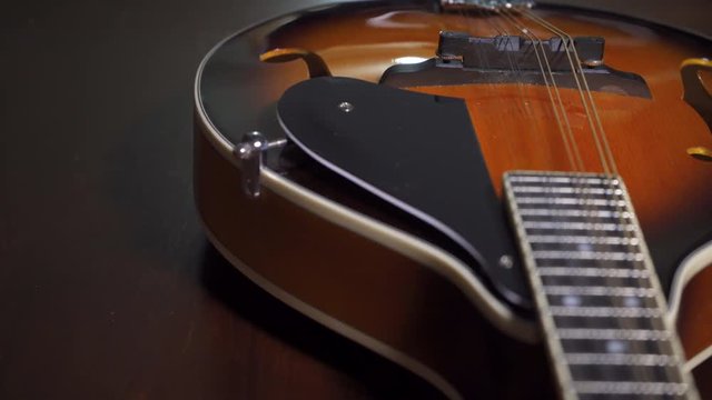Looking down the fretboard of a mandolin.