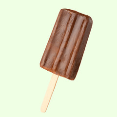 Chocolate popsicle on the sticks, frozen juice. Bright color, summer mood. Ice cream, freshness, Isolate, on a green background