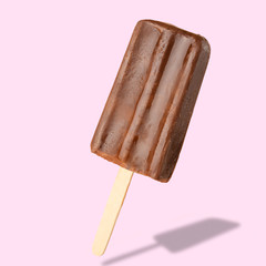 Chocolate popsicle on the sticks, frozen juice. Bright color, summer mood. Ice cream, freshness, Isolate, on a pink background
