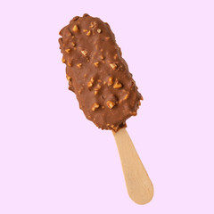 Chocolate popsicle on the sticks, ice cream in milk chocolate and with a wink. Bright color, summer mood. Ice cream, freshness, Isolate, on a pink background