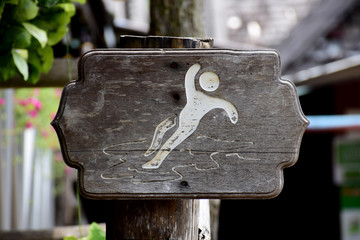 Beware the slippery wooden sign with the logo.