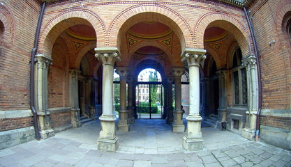 arched brick entrance and corridor with columns