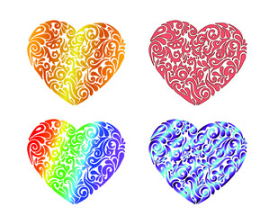 Set of four different colored hand drawn tribal tattoo hearts. Isolated vector illustration