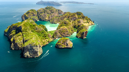 Aerial drone view of tropical Ko Phi Phi island, beaches and boats in blue clear Andaman sea water from above, beautiful archipelago islands of Krabi, Thailand