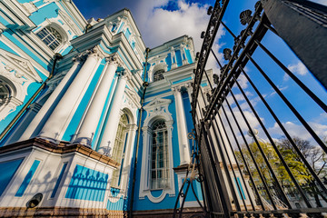 Naklejka premium Smolny or Voskresensky Smolny monastery is located on Rastrelli square, on the banks of the Neva river in St. Petersburg, Russia, beautiful sky.