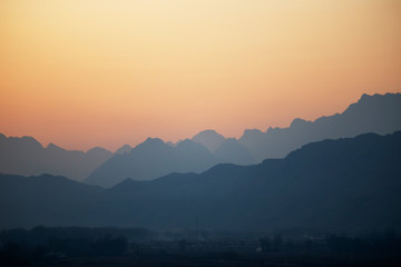 The misty peaks were at sunset