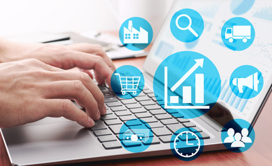 Enterprise resource planning concept. Businessman analyzing data.Many graphs and charts on laptop display. Business management icons.