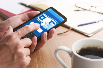 Using smartphone for money transfer and banking.Closeup of male hands touching smartphone screen.