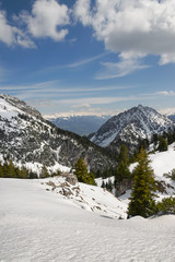 Fototapeta na wymiar Beautiful view on Austrian Alps covered with snow on sunny day in springtime in Tyrol region.