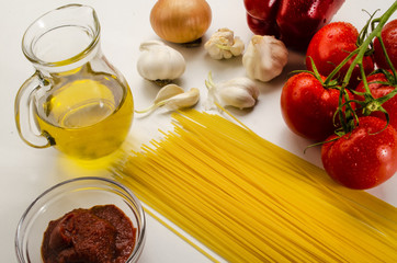 ingredients to make a delicious organic tomato sauce with spaghetti