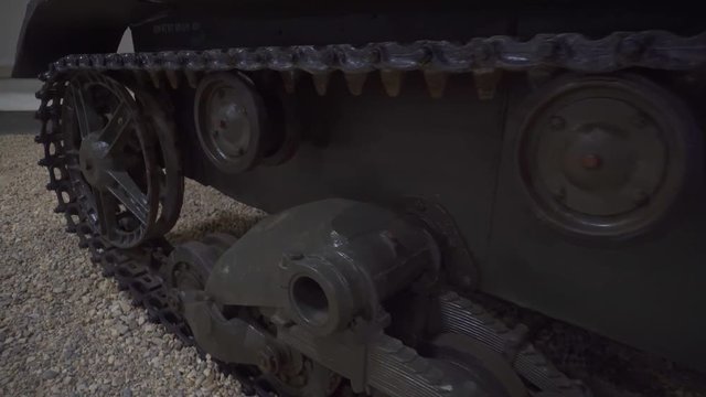 Soviet Russian World War II tank caterpillars and wheels of military heavy tank. Close up