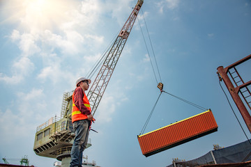 engineering, loading master takes control loading with gantry crane for lifting safety operation in...