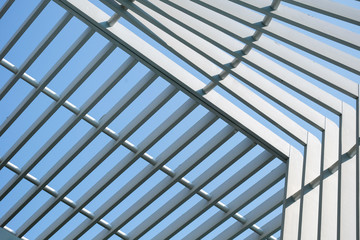 selective focus metal cage under blue sky.