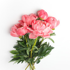 bouquet of fresh peonies on a white background in the center of the frame. flat lay, top view