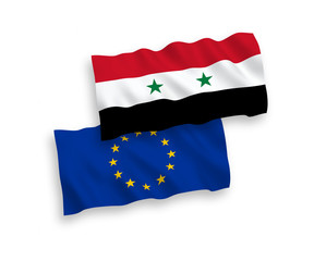 National vector fabric wave flags of Syria and European Union isolated on white background. 1 to 2 proportion.