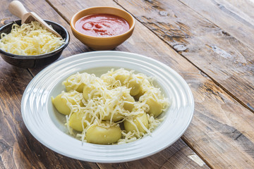 gnocchi stuffed with pesto with homemade tomato sauce and cheese