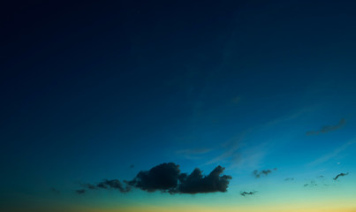 Fototapeta na wymiar Beautiful dark blue and little warm yellow sunset sky .