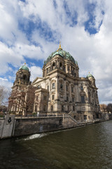 Fototapeta na wymiar Beautiful view of the historic landmark Berliner Dom (Berlin Cathedral) by the Spree River in Berlin, Germany, on a sunny day.