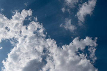 Blue sky with clouds and sunlight