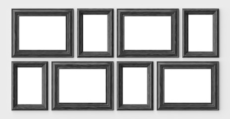 Black wooden frames for picture or photo on white wall with shad