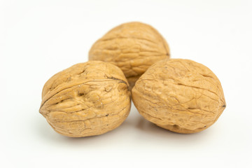 Close-up of fresh walnuts isolated on white background. Healthy nuts with omega 3 fatty acids and antioxidants for beautiful skin and healthy Life.