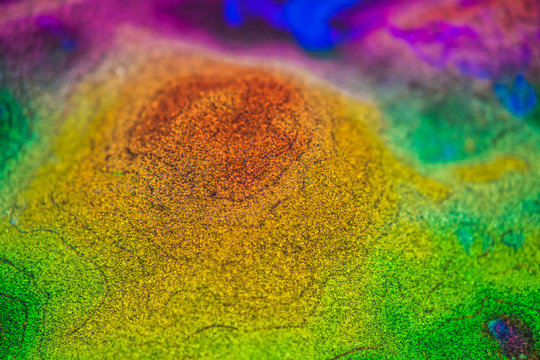 The levels of the heights of the mountains on a map made of sand