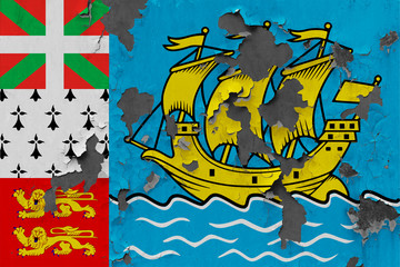 Obraz na płótnie Canvas Close up grungy, damaged and weathered Saint Pierre And Miquelon flag on wall peeling off paint to see inside surface.