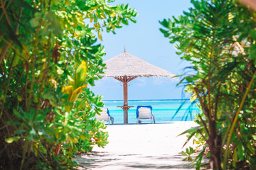Fototapeta premium Beach wooden chairs for vacations on tropical beach