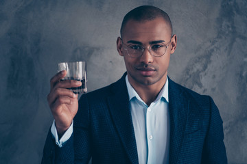 Close up smart cool chic gorgeous manager vip confident eyewear short hair bald millionaire rich luxury relax success celebrate beverage modern eyeglasses  jacket suit isolated dark background 