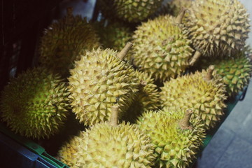 Naklejka na ściany i meble Closeup Ripe Durians market box. Ripe Durians market box. Durian fruit or durio for sale to customers in the basket. Durian market in Sri Lanka