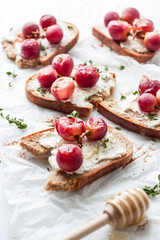 Fresh grape and cream cheese sweet organic toasts