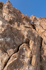 Salty rocks in the plain of salt in the Danakil Depression in Ethiopia in Africa.