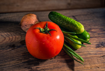 Fresh organic vegetables on rustic wooden background