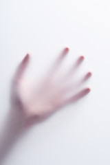 Hand shadow behind frosted glass concept