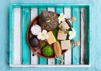 Spa and wellness massage setting. Colorful wooden background. Top view. Copy space.