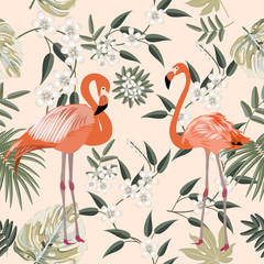 Seamless pattern of flamingo, leaves monstera. Tropical leaves of palm tree and flowers.