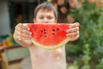 Summer healthy diet. cheerful child eating juicy watermelon. Healthy eating seasonal berries and fruits. kids summer fruits.Selective focus