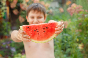 Summer healthy diet. cheerful child eating juicy watermelon. Healthy eating seasonal berries and fruits. kids summer fruits.Selective focus