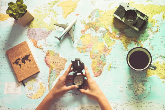 Young Woman Drinking Coffee And Planning World Tour With Vintage Travel Map - Backpacker Girl Looking For A New Countries To Explore - Journey Trends, Globetrotter And Holiday Concept - Focus On Mug