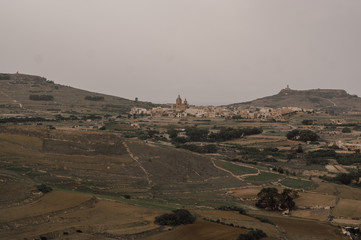 View to countryside and Corpus Christi Parish Church from Cittadella in Victoria