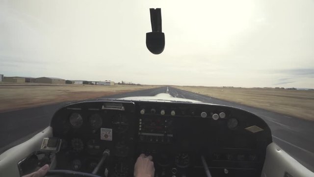 View from inside the cockpit of a small plane while it is taking off