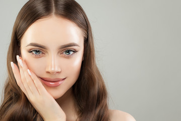 Fototapeta premium Beautiful female face closeup. Healthy smiling woman portrait