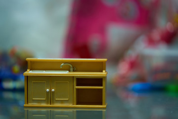Sink furniture toy on blur background