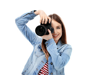 Young female photographer on white background