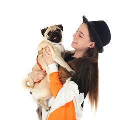 Teenage girl with cute pug dog on white background